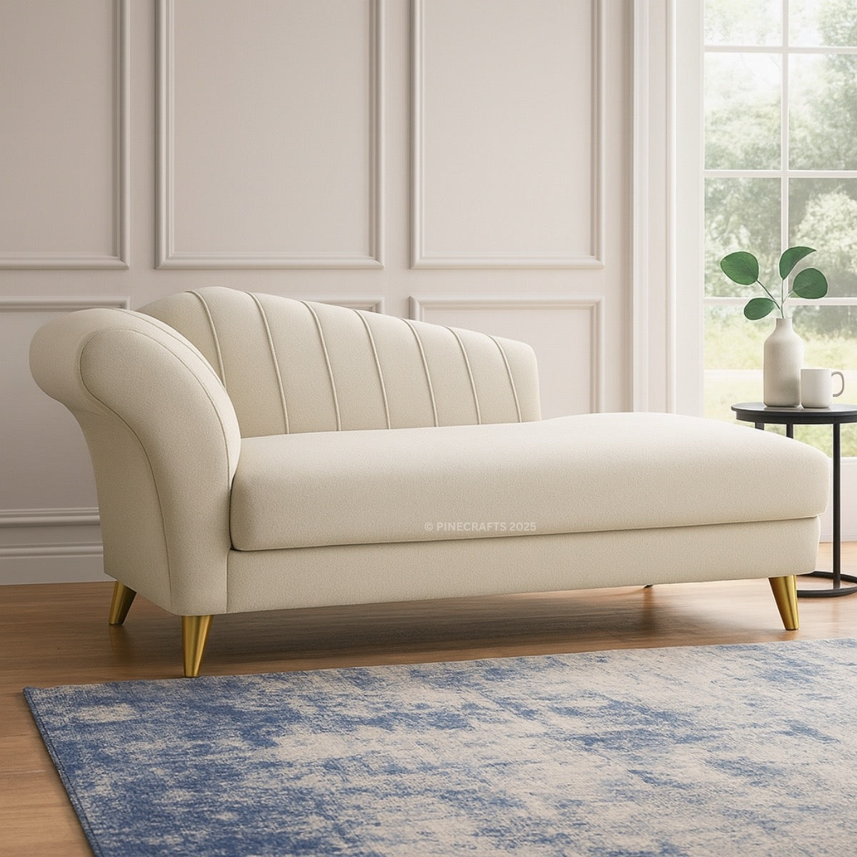 Beige sofa in a room with a blue rug and a window in the background
